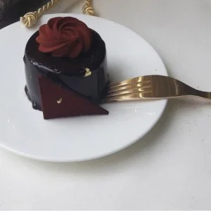 Tissu en coton enduit blanc pailleté or